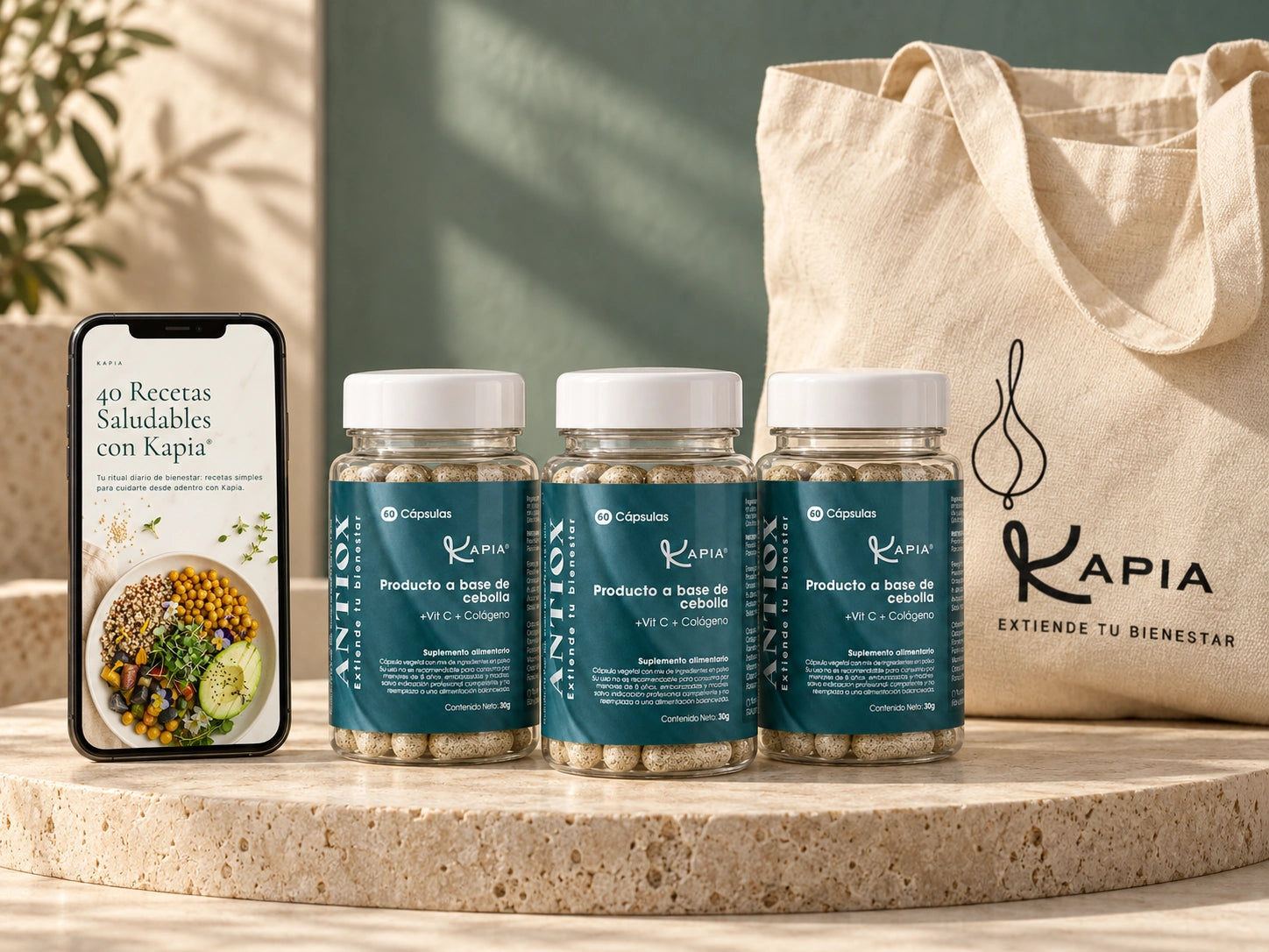 Tres frascos Kapia Antiox, totebag Kapia y ebook digital de 40 recetas en un teléfono