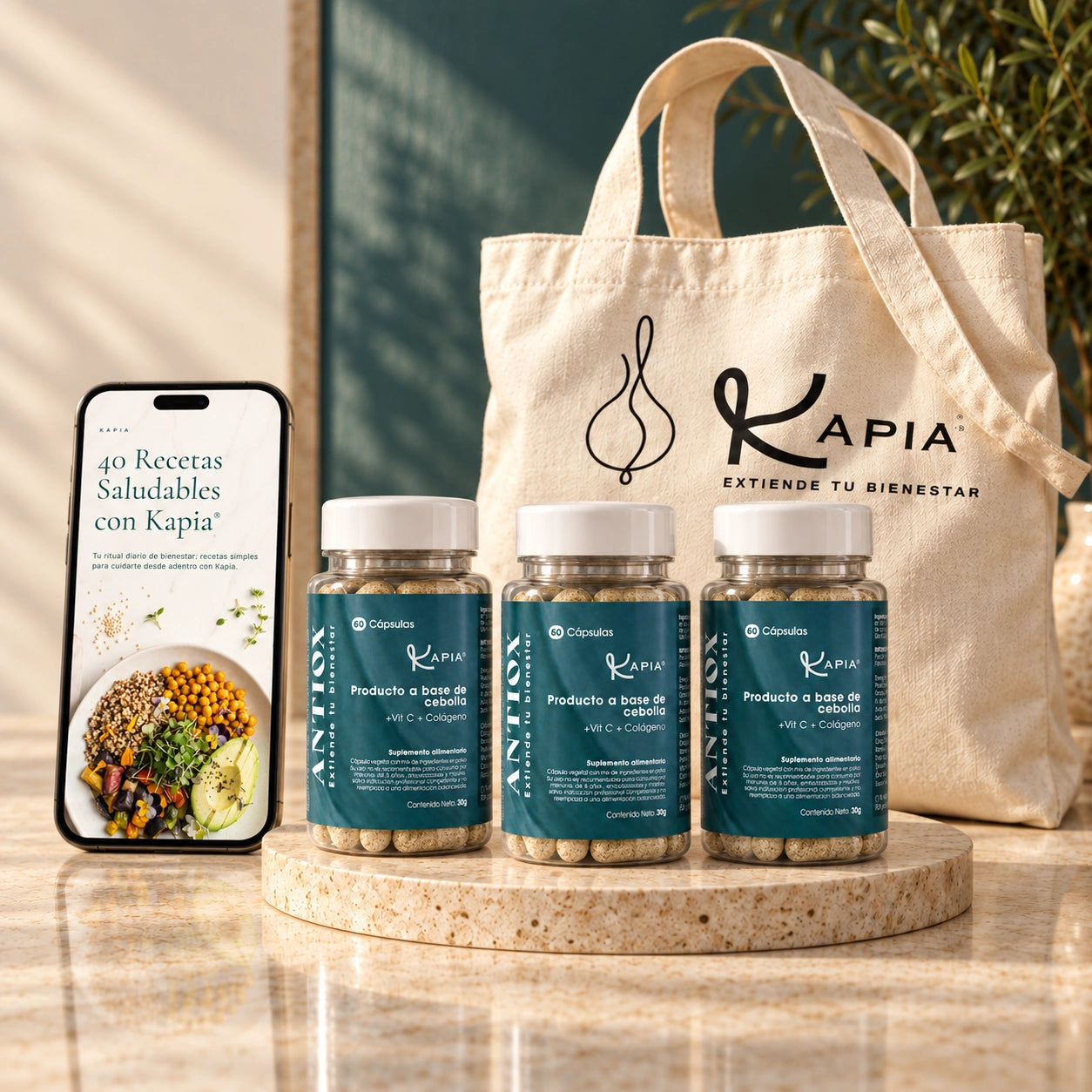 Tres frascos reales Kapia Antiox, totebag Kapia y ebook digital de 40 recetas en un teléfono